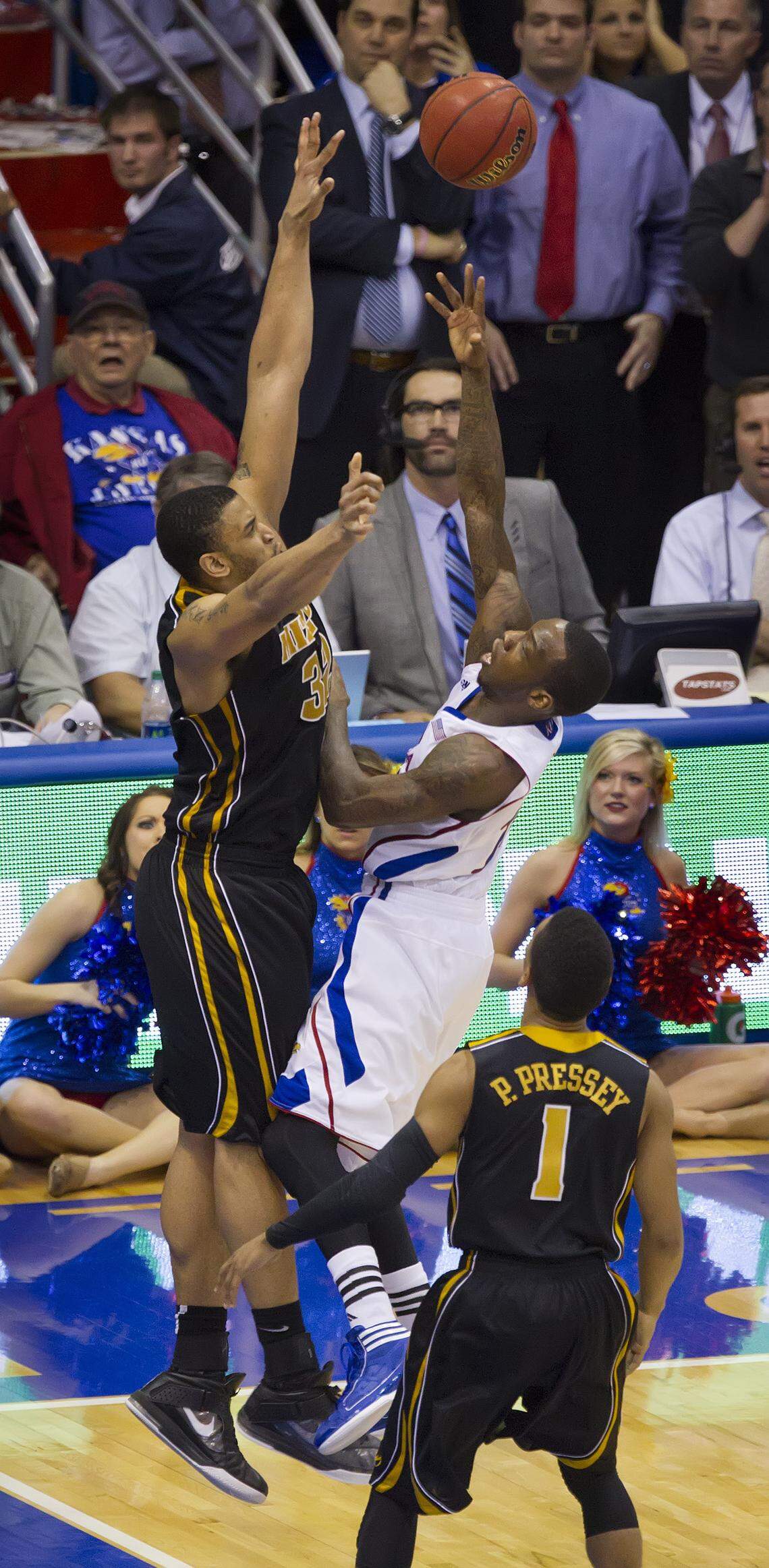 Kansas Jayhawks’ Tyshawn Taylor was fouled by Missouri Tigers’ Steve Moore near the end of overtime on Feb. 25, 2012 at Allen Fieldhouse in Lawrence. Kansas won 87-86.