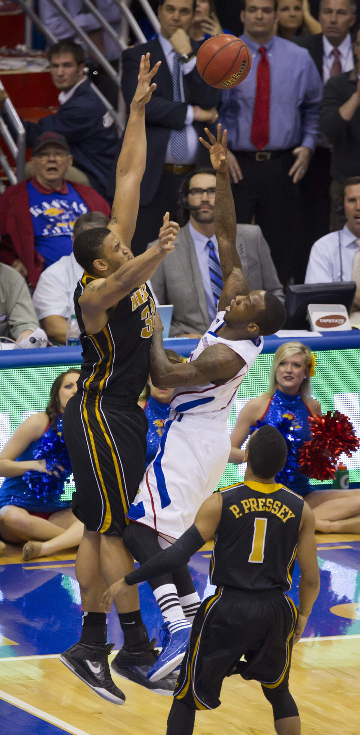 Kansas Jayhawks’ Tyshawn Taylor was fouled by Missouri Tigers’ Steve Moore near the end of overtime on Feb. 25, 2012 at Allen Fieldhouse in Lawrence. Kansas won 87-86.