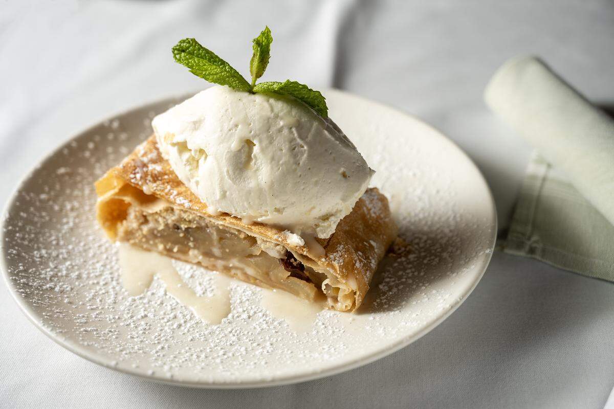 Grünauer serves authentic Austrian and Central European cuisine in Kansas City’s Freight House District. Apfelstrudel, $9, is a classic apple strudel with rum soaked raisins, vanilla sauce top with whipped cream.