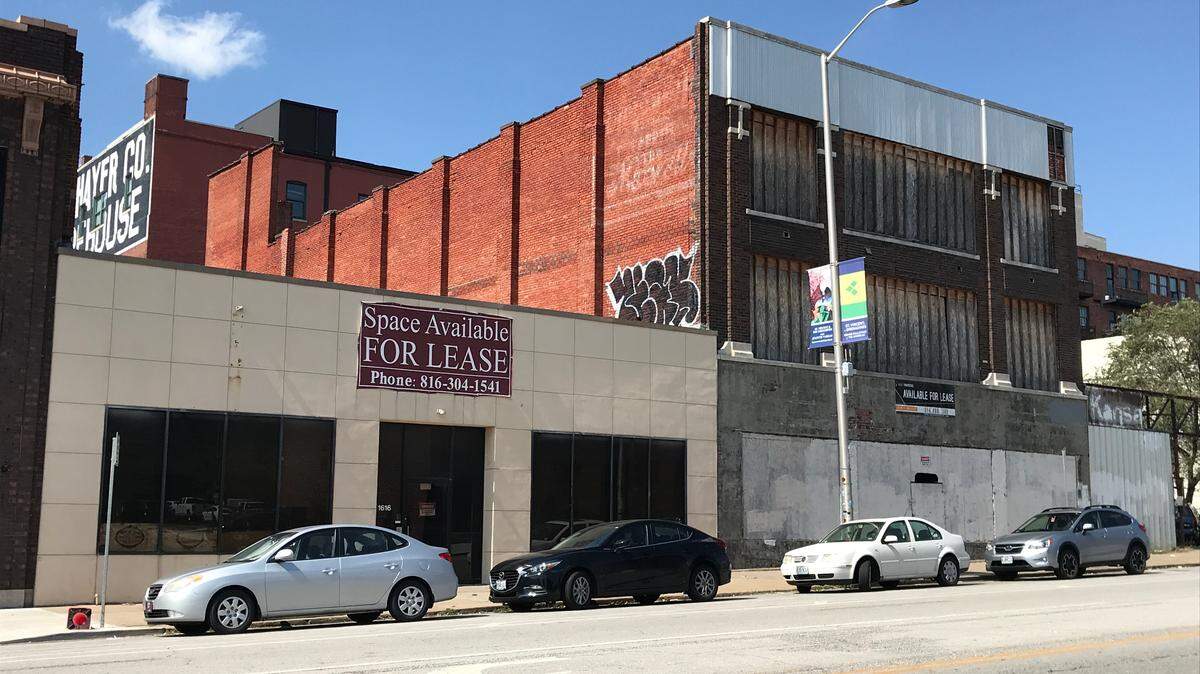 Developer Matt Abbott is planning to convert two buildings on Grand Boulevard into a one-story event space with a rooftop deck and a three story building with retail on the ground level and offices above.
