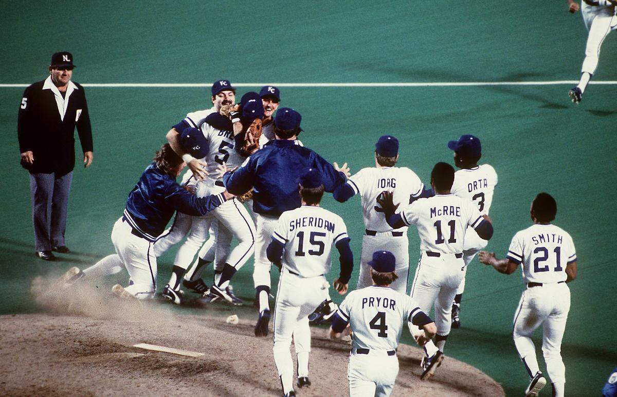 When the Series was over, the team rushed the mound, where third baseman George Brett and pitcher Bret Saberhagen were already locked in a Royal bear hug.