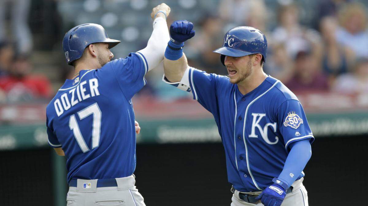 Kansas City Royals’ Ryan O’Hearn, right, and Hunter Dozier celebrate after O’Hearn hit a two-run home run off Cleveland Indians starting pitcher Adam Plutko in the sixth inning of a baseball game, Monday, Sept. 3, 2018, in Cleveland. Dozier scored on the play.