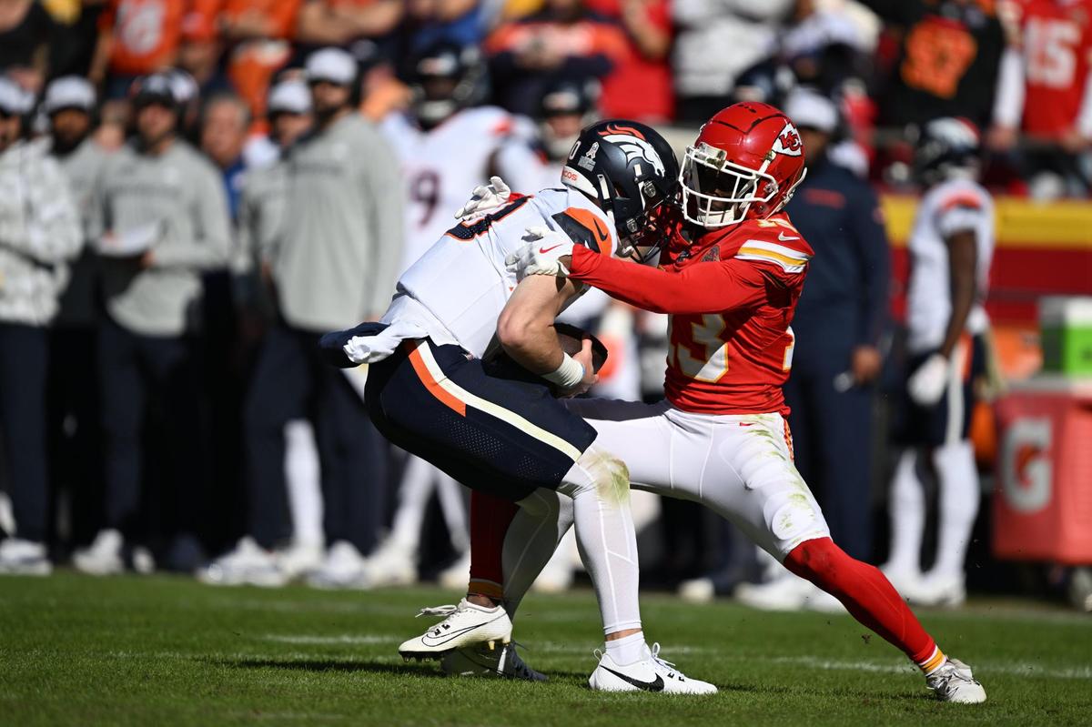 Kansas City Chiefs safety Nazeeh Johnson (13) sacks Denver Broncos quarterback Bo Nix (10) in the first half on Sunday, Nov. 10, 2024, at GEHA Field at Arrowhead Stadium.