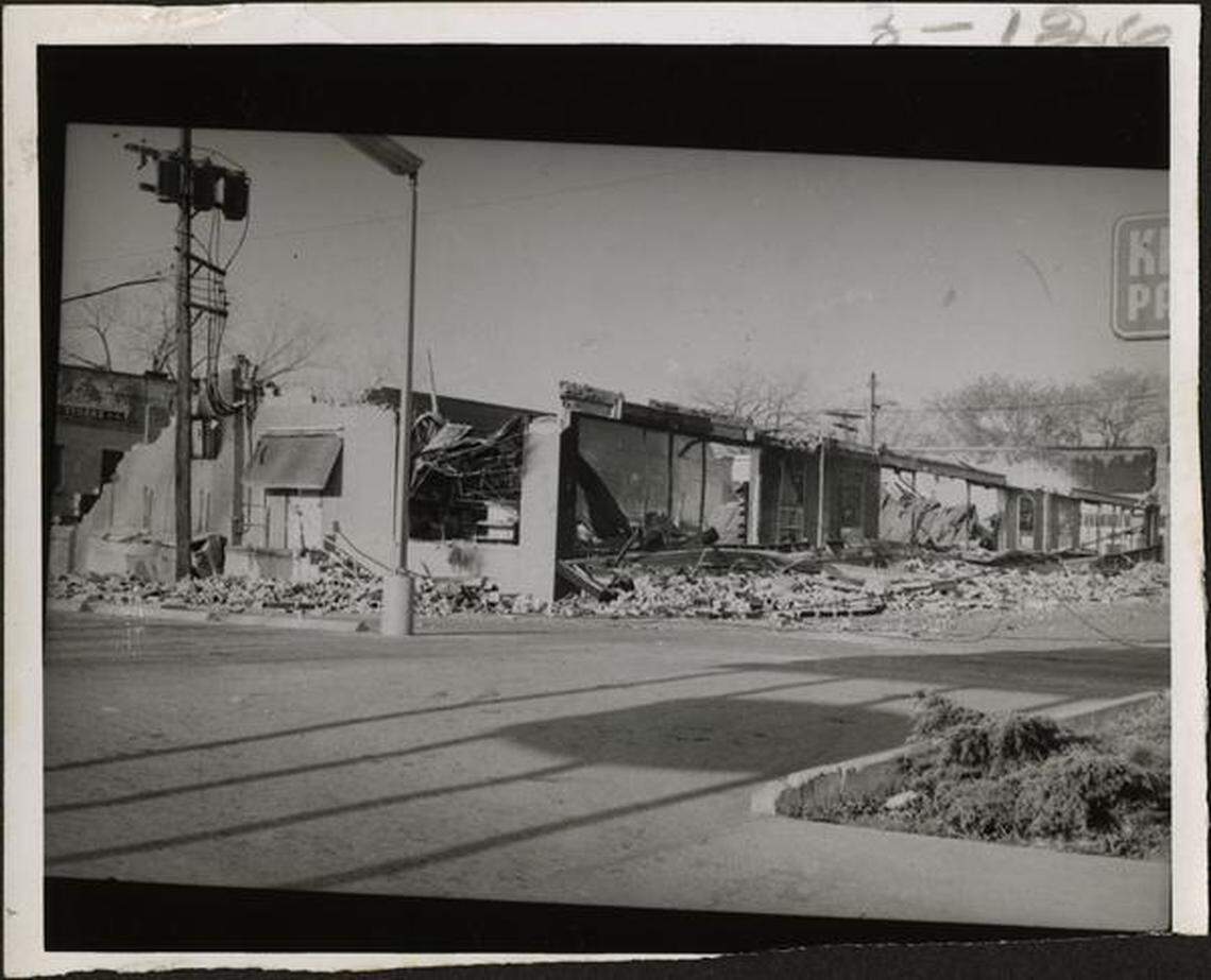 The remains of Crown Drug Store after a fire brought most of the storefront to the ground.