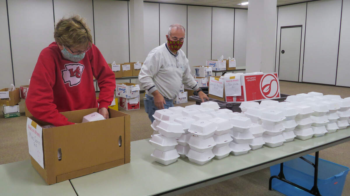 Beth and Allen Garner help to package food that fed hundreds on Christmas morning.