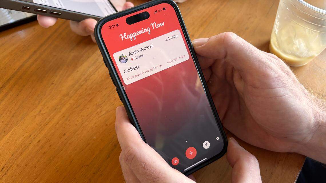 Max Nelson , co-founder of TAP, shows the main screen of the app and how the display looks when another user has a TAP open.