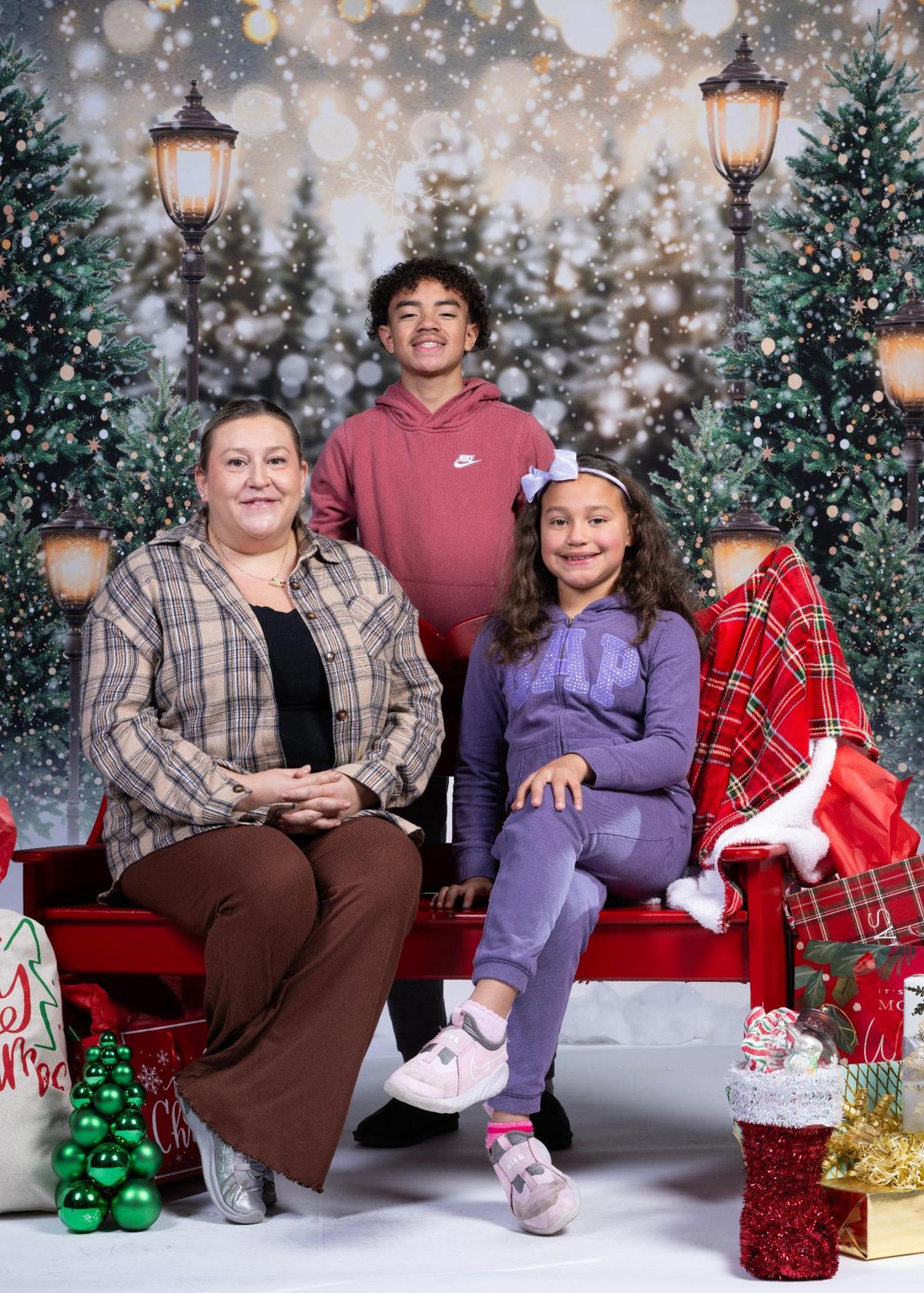 Melissa Rowley, left, Mark Rowley and Aubrey Rowley at the Soul of Santa breakfast.
