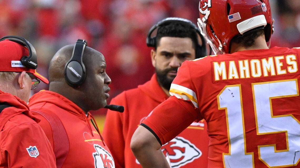 Kansas City Chiefs offensive coordinator Eric Bieniemy, second to left, confers with quarterback Patrick Mahomes during an AFC Championship Game timeout at Arrowhead Stadium on Jan. 30.
