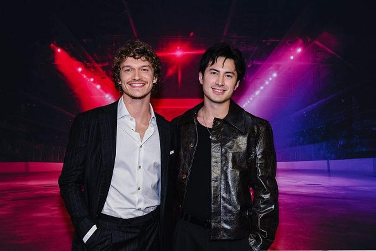 Connor Storrie and Hudson Williams attend the premiere of "Heated Rivalry" at TIFF Lightbox on Nov. 24, 2025 in Toronto, Ontario.