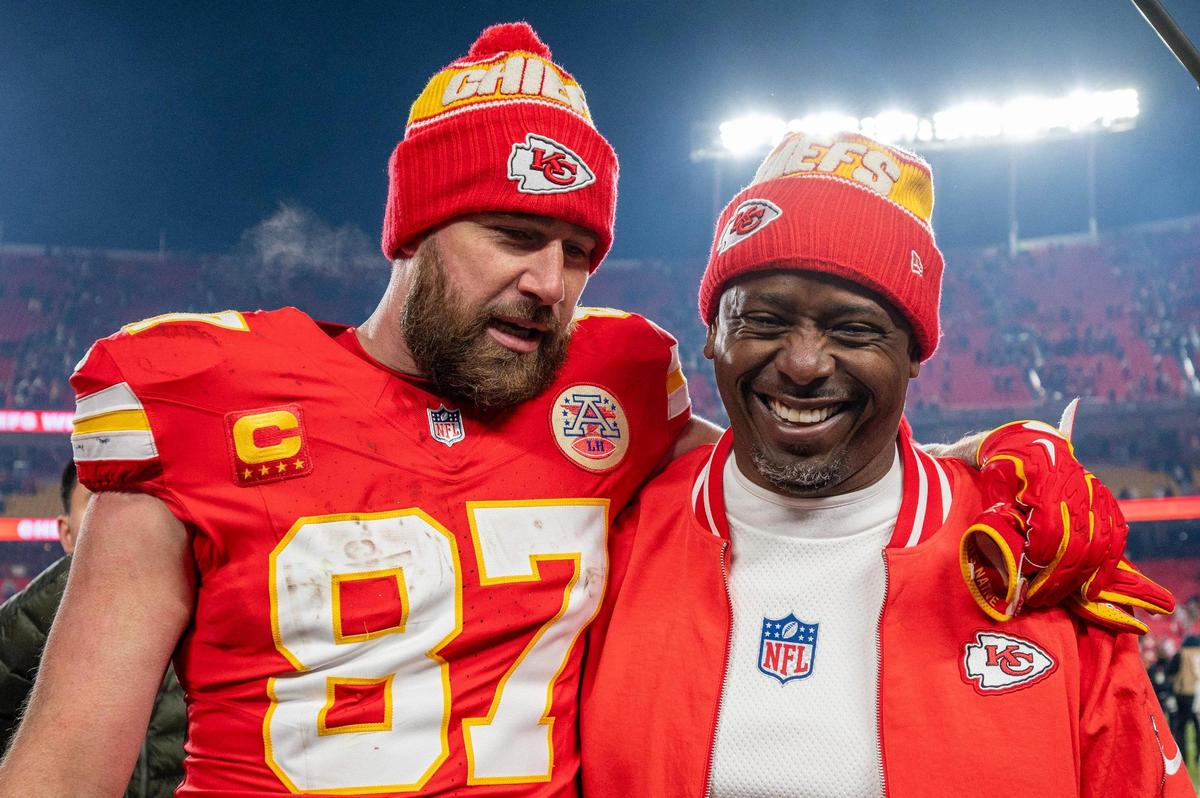 Kansas City Chiefs tight end Travis Kelce (87) walks off the field with Chiefs defensive backs coach Dave Merritt after the Chiefs’ 23-14 victory against the Houston Texans in the AFC Divisional Round playoff game on Saturday, Jan. 18, 2025, at GEHA Field at Arrowhead Stadium.