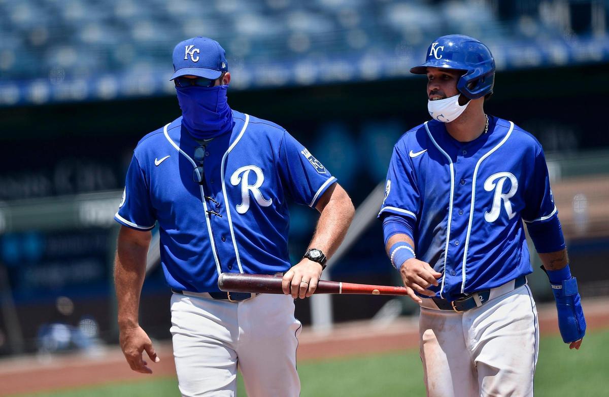 Manager Mike Matheny, left, and infielder Humberto Arteaga head off the field during an intrasquad game at the Kansas City Royals spring training 2.0 at Kauffman Stadium Monday, July 7, 2020.