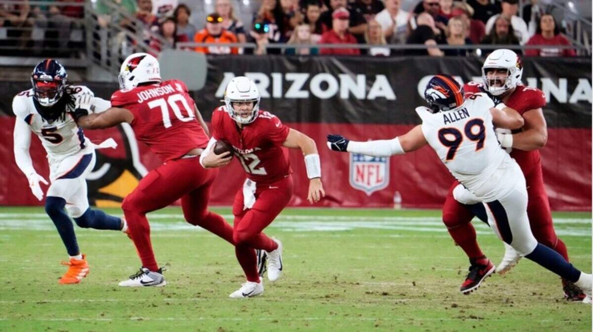 Arizona Cardinals quarterback Colt McCoy (12) runs with the ball against the Denver Broncos during a preseason game at State Farm Stadium in Glendale on Aug. 11, 2023.