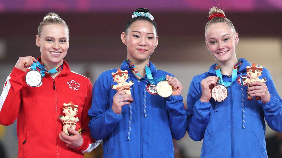 From left: Ellie Black (silver), Kara Eaker (gold) and Riley McCusker (bronze) pose with their balance beam medals on Wednesday at the Pan American Games.