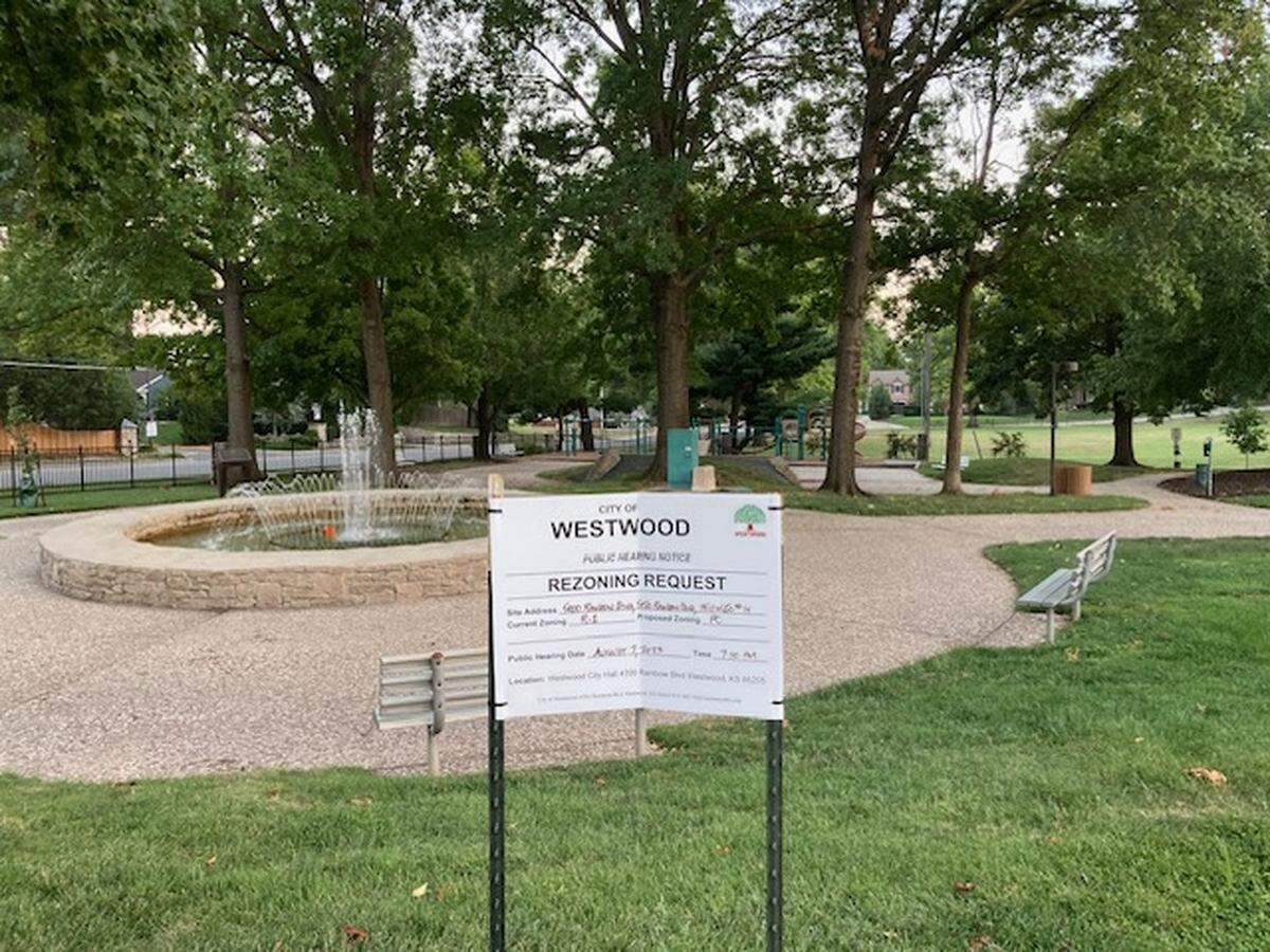 A sign at Joe. D. Dennis Park at 50th Street and Rainbow Boulevard in Westwood, announces an Aug. 7 public hearing to consider rezoning of the park and adjacent acres for a proposed office and retail development. The next meeting will be Sept. 11.