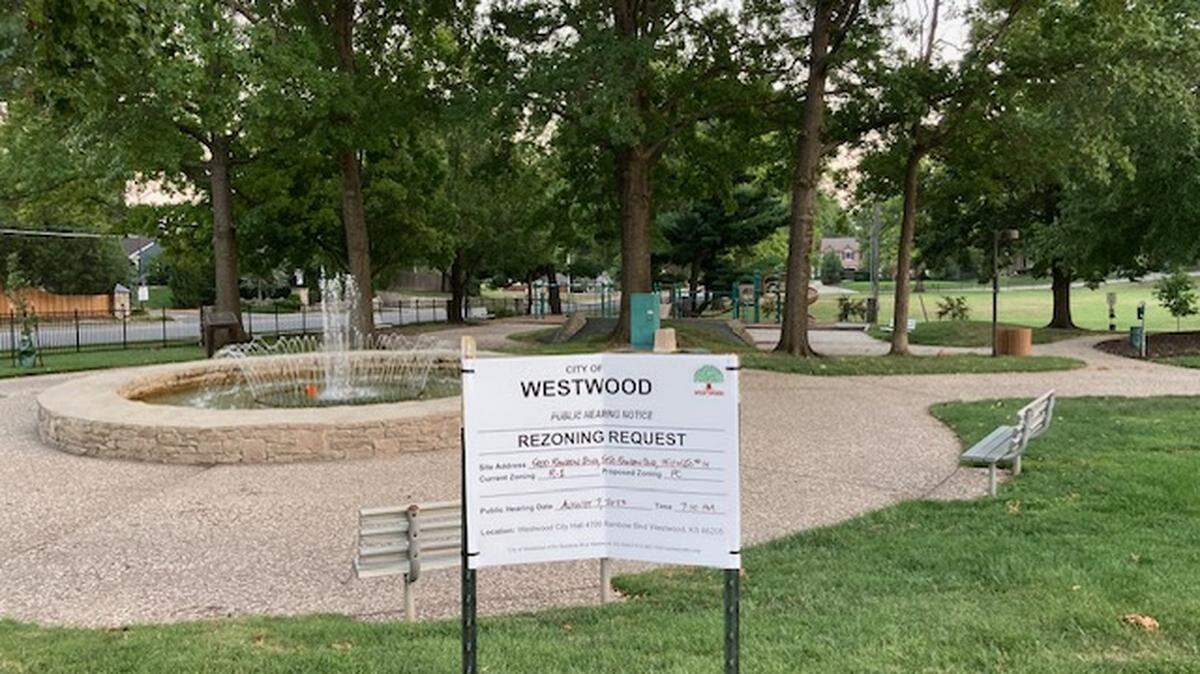 A sign at Joe. D. Dennis Park at 50th Street and Rainbow Boulevard in Westwood announced a public hearing to consider rezoning of the park and adjacent acres for a proposed Karbank office and retail development. At an Oct. 12 meeting, the City Council approved the plan.