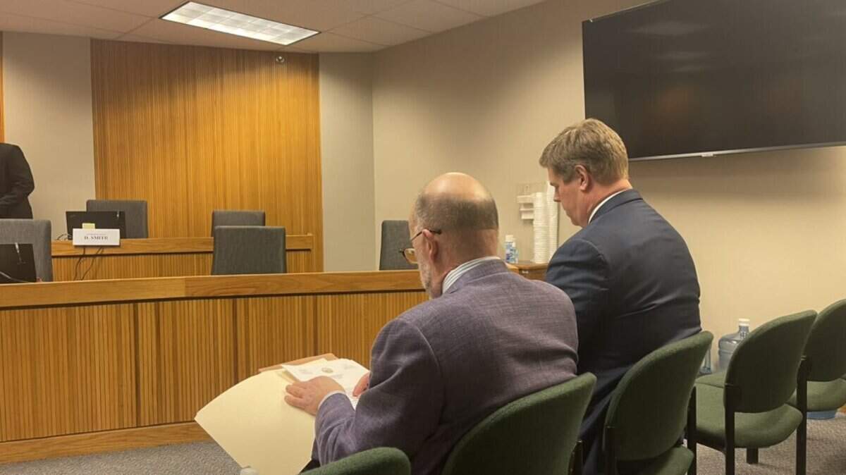 Missouri House Speaker Dean Plocher (right) sits with his attorney Lowell Pearson (left) ahead of a House Ethics Committee hearing.