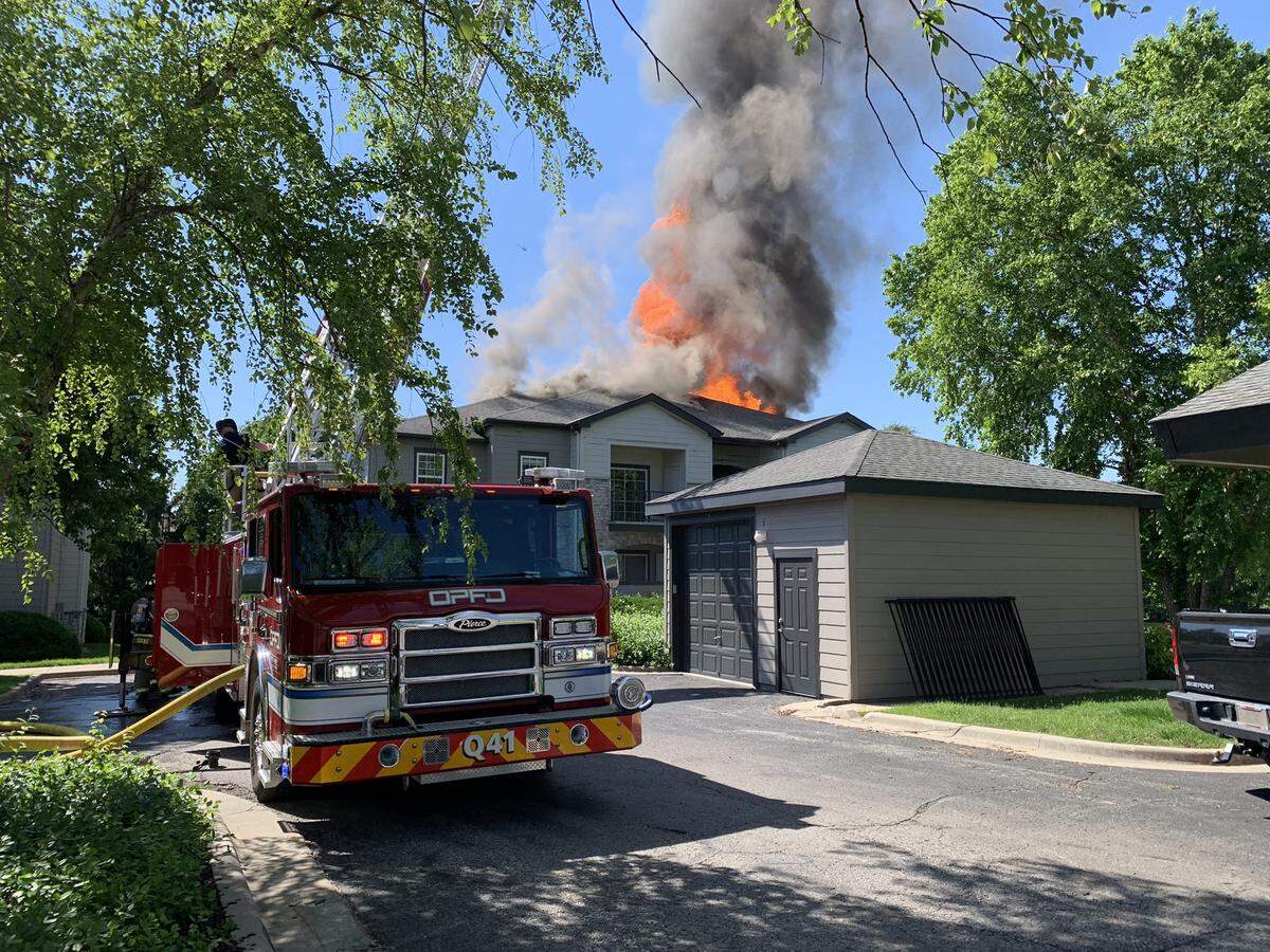 Flames climbed into the area from a blaze that had engulfed a building in the Highlands North and South complex in the 8000 block of Farley St. No injuries were initially reported. 