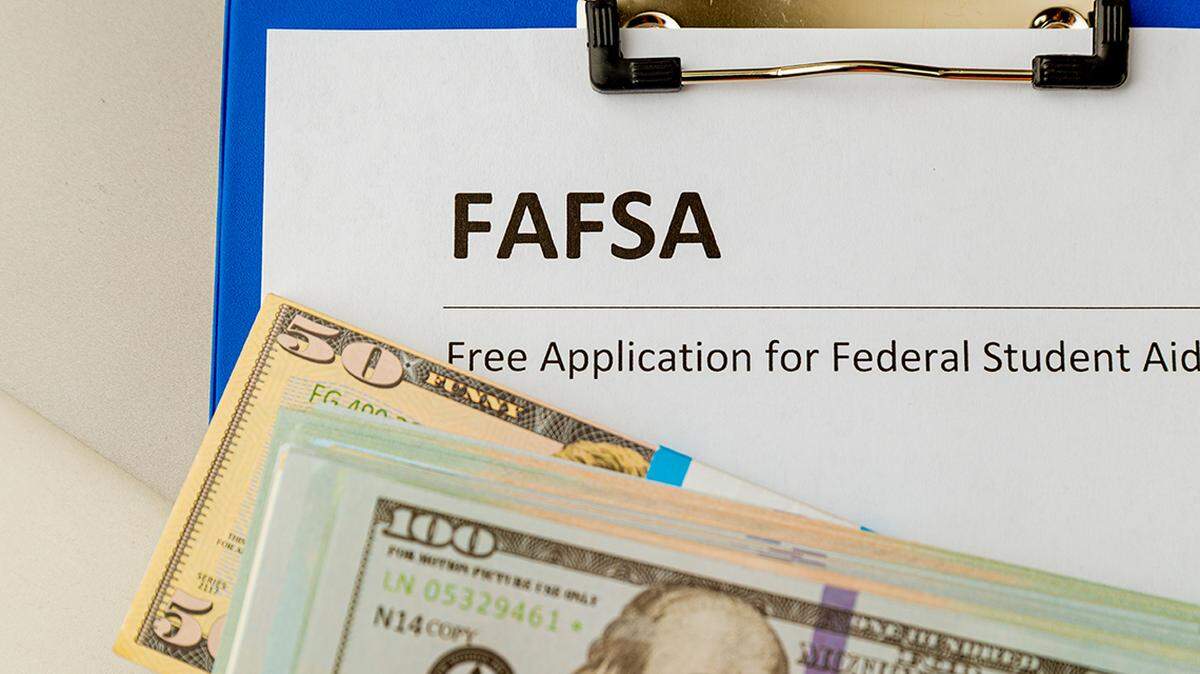 Fafsa. Student aid. Money on the table. loan lend