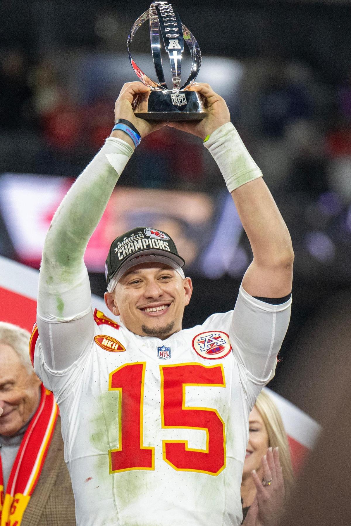 Kansas City Chiefs quarterback Patrick Mahomes (15) raises the Lamar Hunt Trophy after defeating the Baltimore Ravens 17-10 in the AFC Championship Game at M&T Bank Stadium on Sunday, Jan. 28, 2024, in Baltimore.