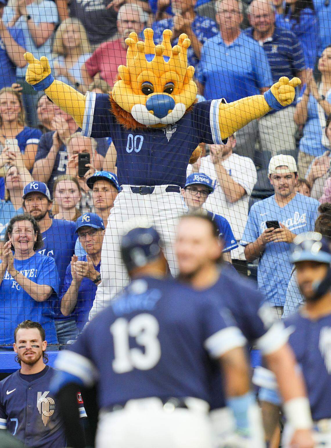 Royals mascot Sluggerrr celebrates after a home run by catcher Salvador Perez against the Toronto Blue Jays at Kauffman Stadium in Kansas City on Friday, Sept. 19, 2025.