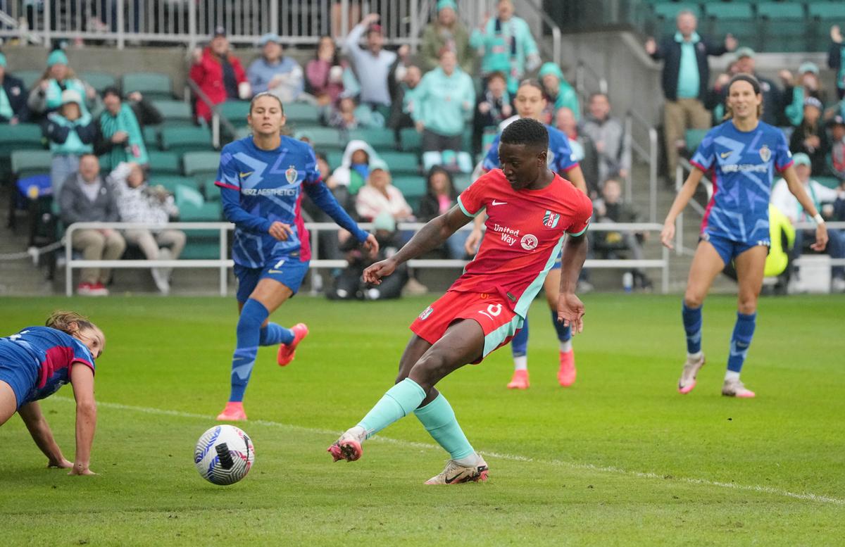 Kansas City Current forward Temwa Chawinga scores a goal against the North Carolina Courage during an NWSL playoff match at CPKC Stadium.