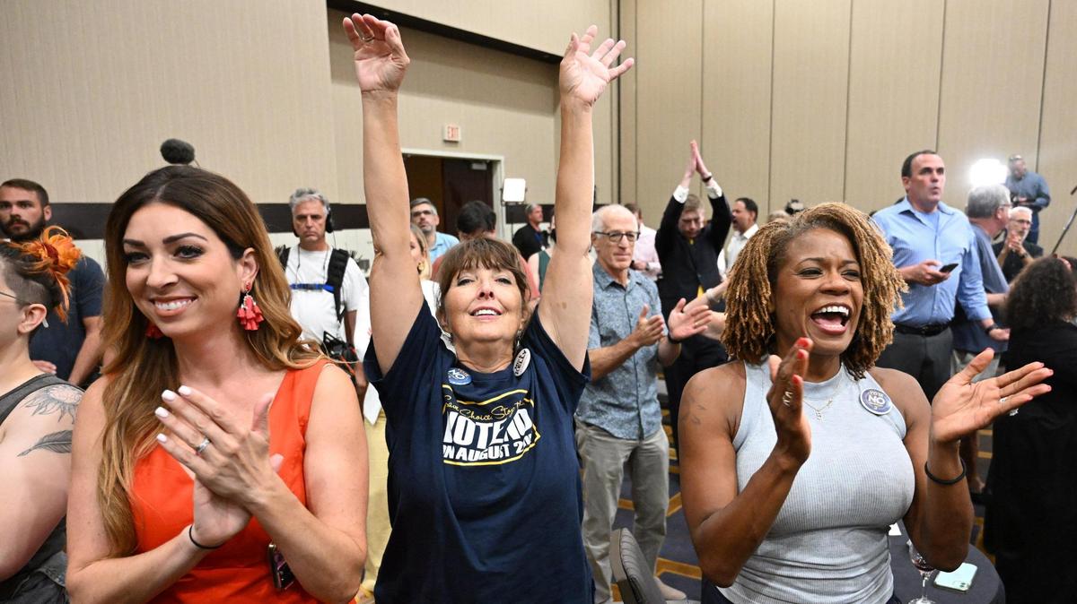 Calley Malloy, left, of Shawnee, Cassie Woolworth of Olathe and Dawn Rattan of Shawnee applauded the Kansans for Constitutional Freedom and supporters celebrated their win during an election watch party Tuesday, August 2, 2022, at the Overland Park Convention Center, 6000 College Blvd. The group backed a ‘No’ vote on the constitutional amendment, which if passed would have removed the right to an abortion from the Kansas constitution.
