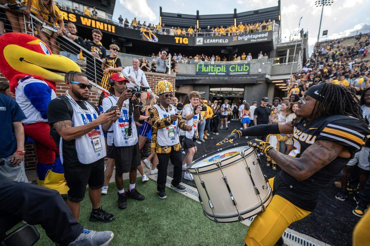 Missouri Tigers wide receiver Marquis Johnson (2) beats a drum featuring the Jayhawk mascot after Missouri's 42-31 win over the Kansas Jayhawks at Faurot Field at Memorial Stadium on Saturday, Sept. 6, 2025, in Columbia.
