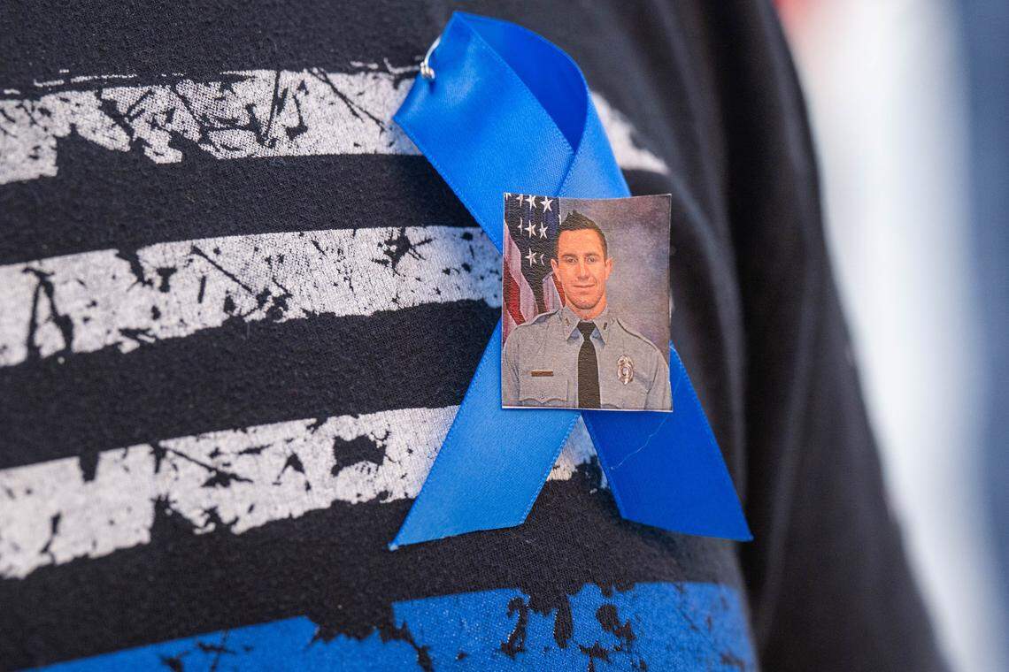 A ribbon with the face of slain KCKPD officer Hunter Simoncic, at a candlelight vigil in his honor, on Thursday, Aug. 28, 2025, in Kansas City, Kansas.