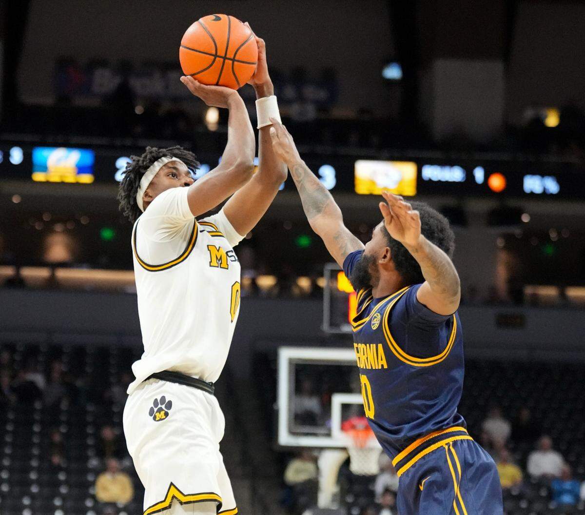 Missouri Tigers guard Anthony Robinson II puts up a shot over California Golden Bears center Mady Sissoko during a Tuesday, Dec 3, 2024 men’s college basketball game Mizzou Arena in Columbia.