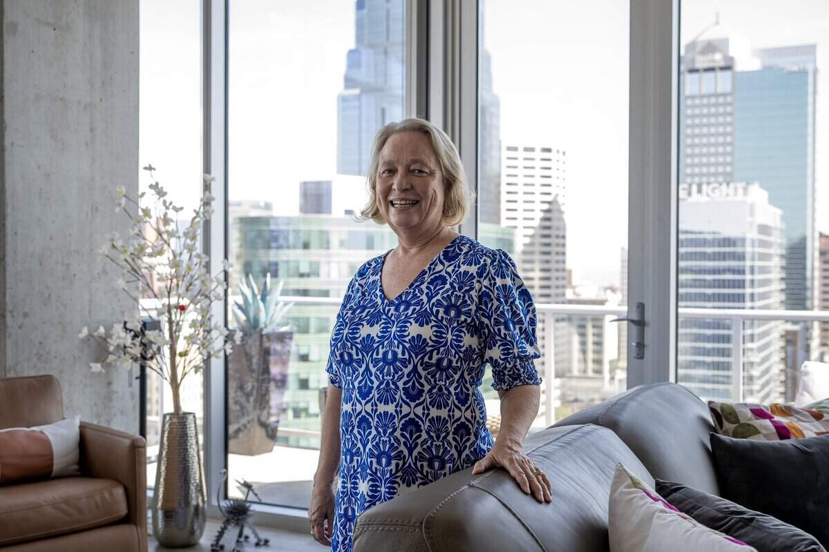 Pam Klein stands for a portrait in the main living area of her apartment at Two Light Luxury Apartments on Tuesday, June 30, 2026, in Kansas City.