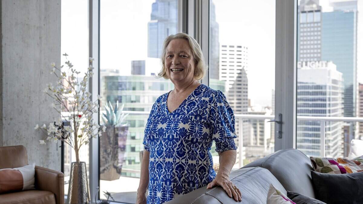 Pam Klein stands for a portrait in the main living area of her apartment at Two Light Luxury Apartments on Tuesday, June 30, 2026, in Kansas City.
