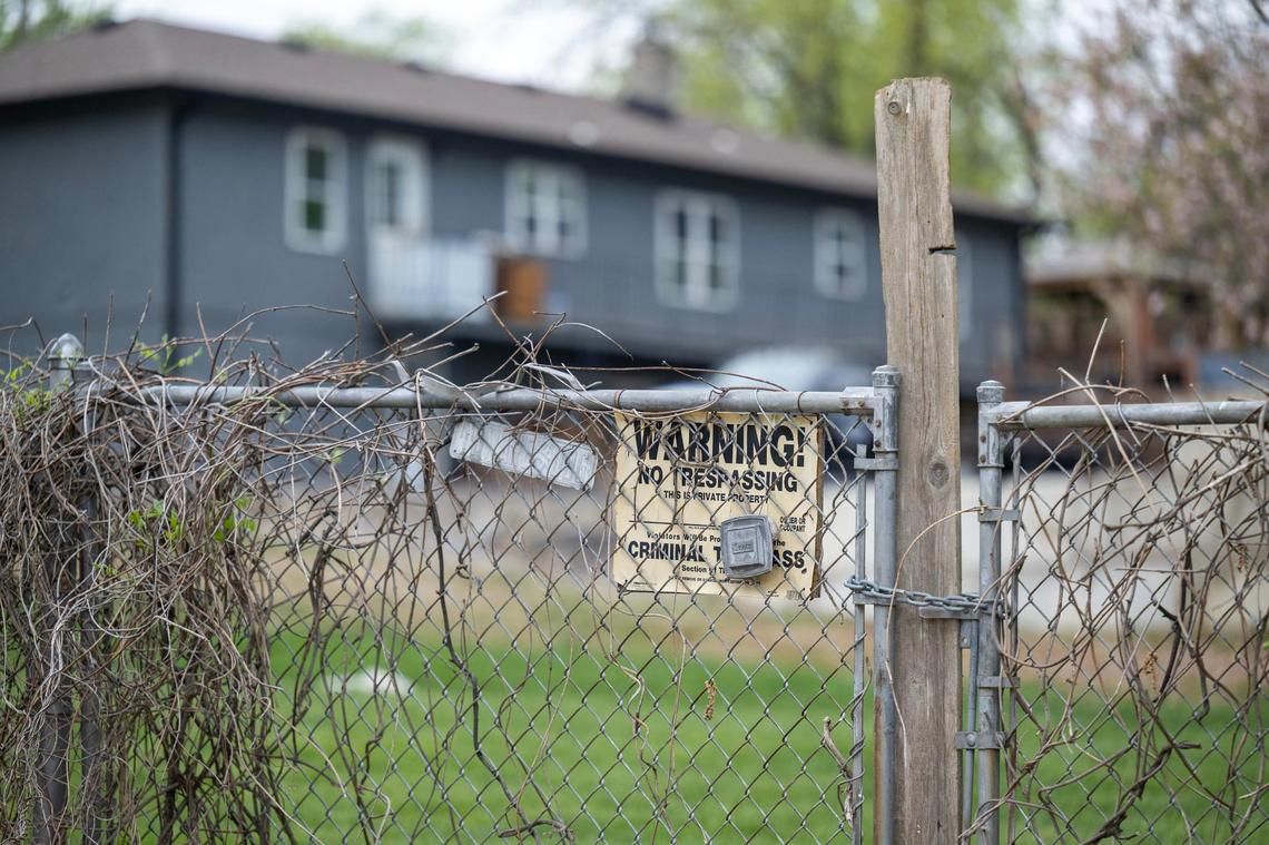 A no trespassing sign hangs on the fence of a home known to keep several large dogs in the 3700 block of N.E. Russell Rd., in the Chaumiere neighborhood located north of the river in Kansas City.