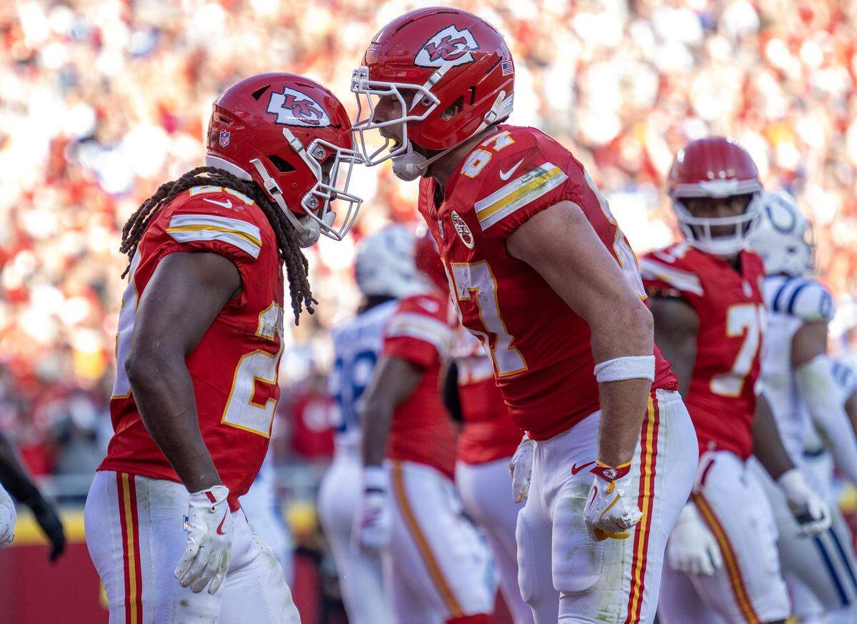 Chiefs running back Kareem Hunt, left, celebrates his touchdown with tight end Travis Kelce during an NFL Week 12 game against the Indianapolis Colts at GEHA Field at Arrowhead Stadium in Kansas City on Sunday, Nov. 23, 2025. The Chiefs defeated the Colts 23-20 in overtime.