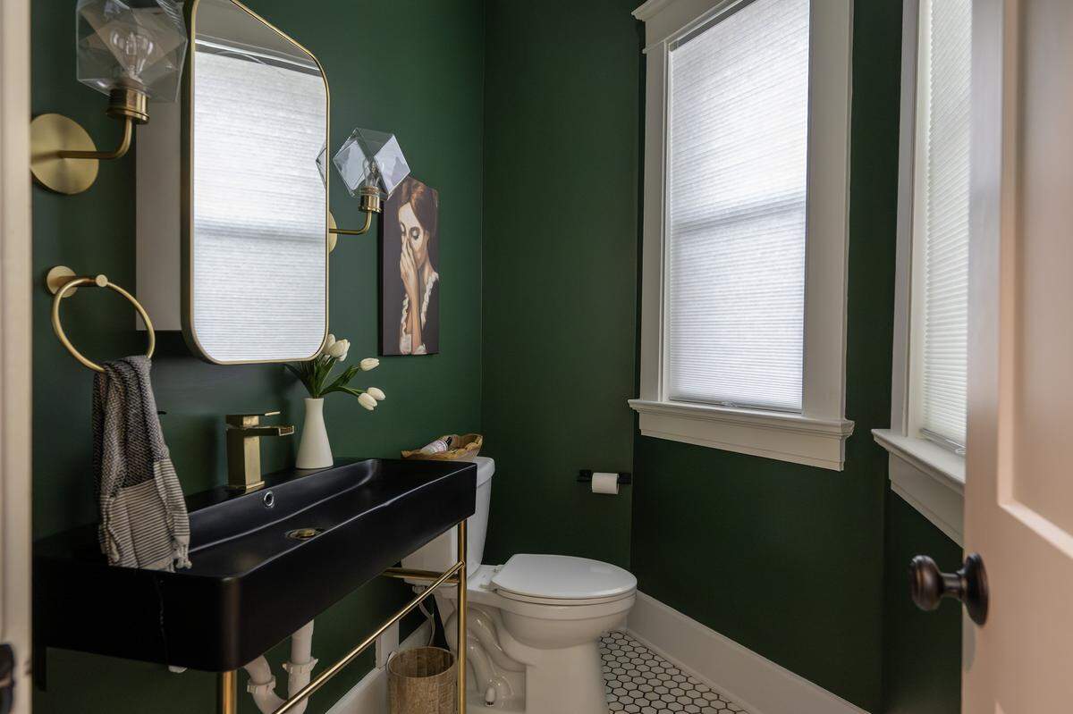 A half bathroom near the kitchen is pictured on the main floor of the historic Valentine Castle.