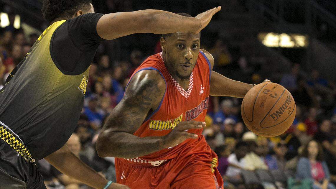 Mario Chalmers (right) of the KU alumni team drove toward the basket during a Rivalry Renewed KU-Missouri alumni basketball game Saturday, July 28 2018 at Silverstein Eye Centers Arena in Independence.