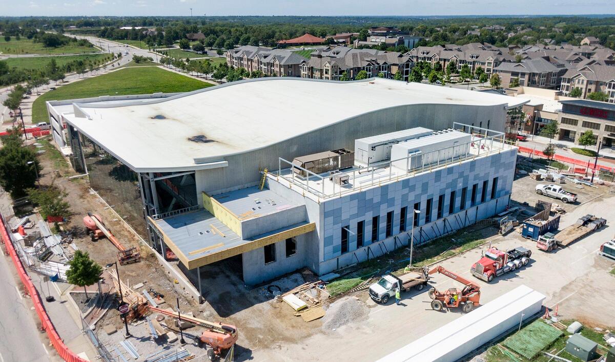 The outside of the aquatic center in Lenexa is meant to look like rippling water, with blue tiles and a wavy roof.