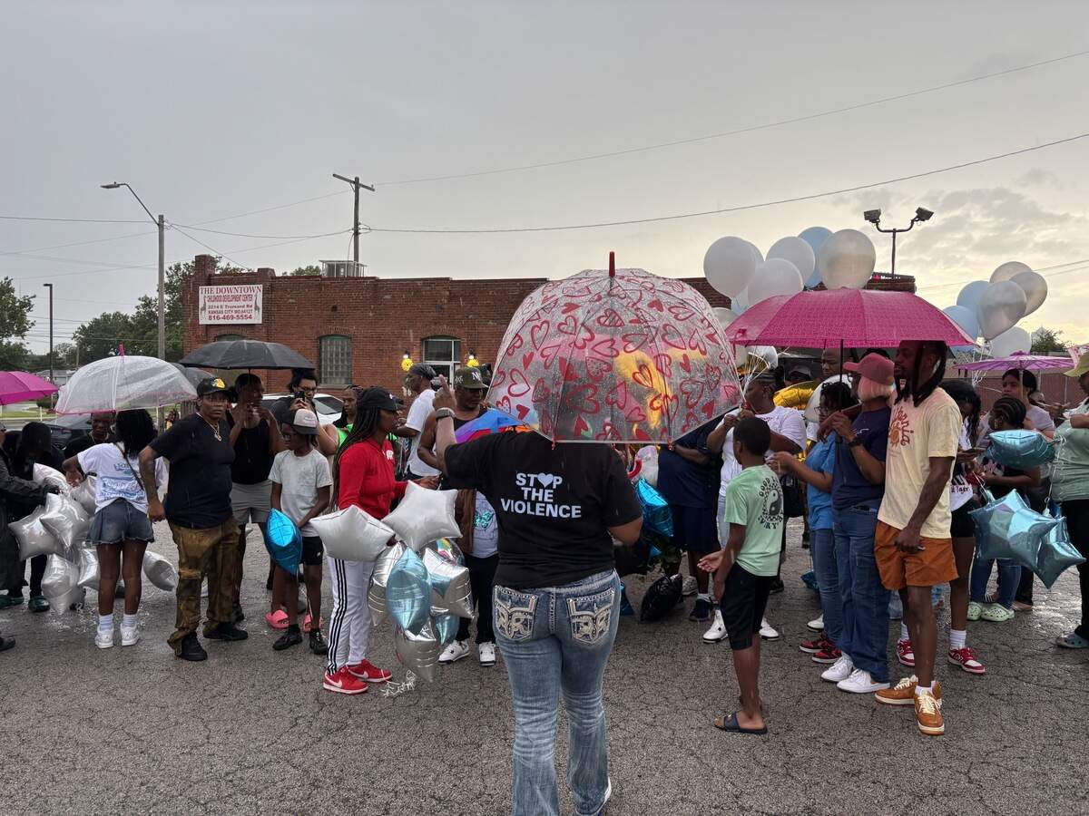 KC Mothers in Charge Founder and Program Director Rosilyn Temple, center, hosted the vigil remembering Taylor and Byron Garrett. Community members gathered in a circle to speak about the brothers.