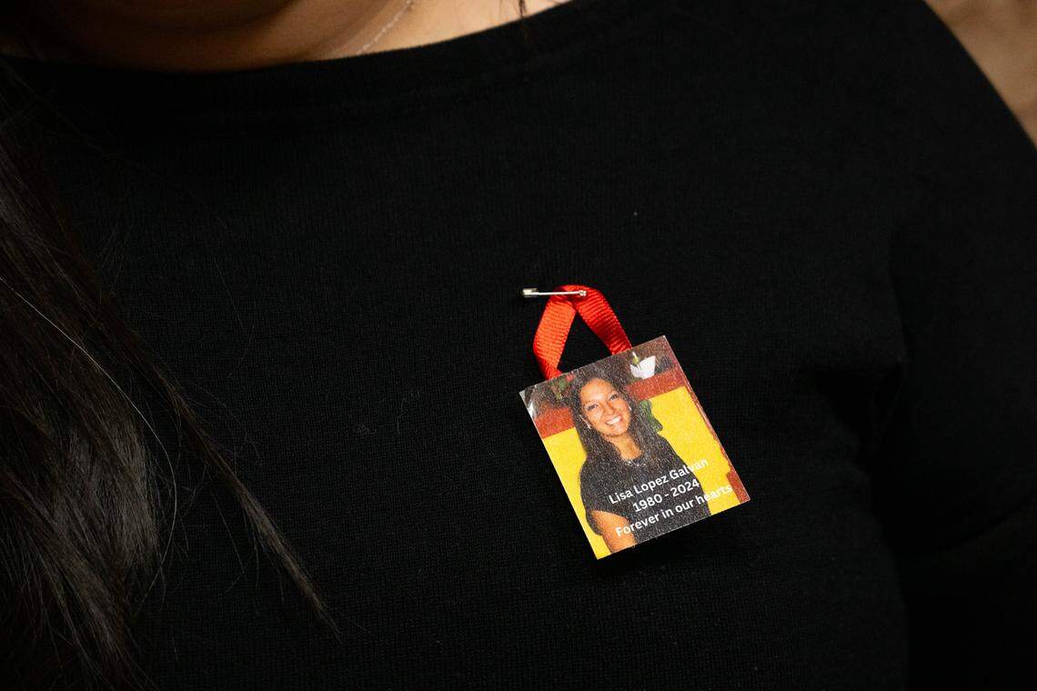 Gabriella Grado, family member of Lisa Lopez-Galvan, wears a pin with her face on it at the hearing for plea hearing for Dominic Miller, at the Jackson County Courthouse, on Monday, March 9, 2026, in Kansas City. Miller is accused of fatally shooting Lopez-Galvan during the 2024 Chiefs Super Bowl rally mass shooting.