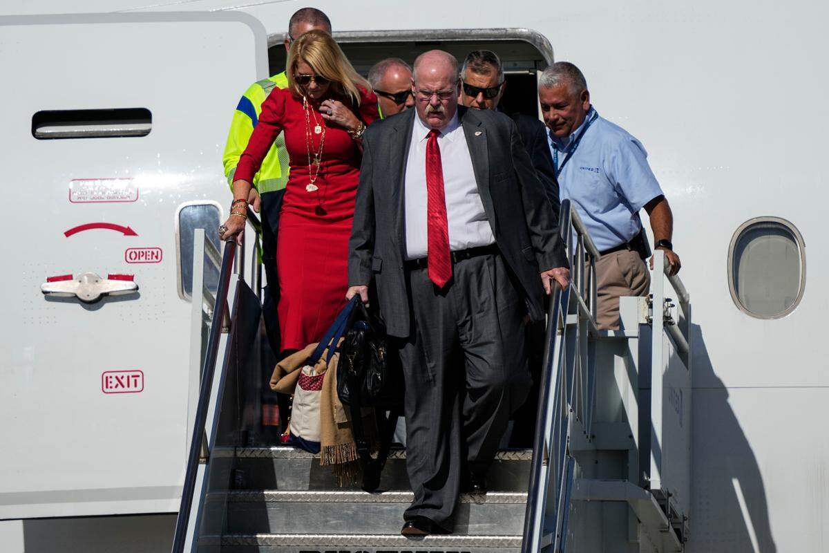 Kansas City head coach Andy Reid and his wife Tammy Reid arrive with the team ahead of Super Bowl 57, Sunday, Feb. 5, 2023, in Phoenix. The Kansas City Chiefs will play the Philadelphia Eagles on Sunday.