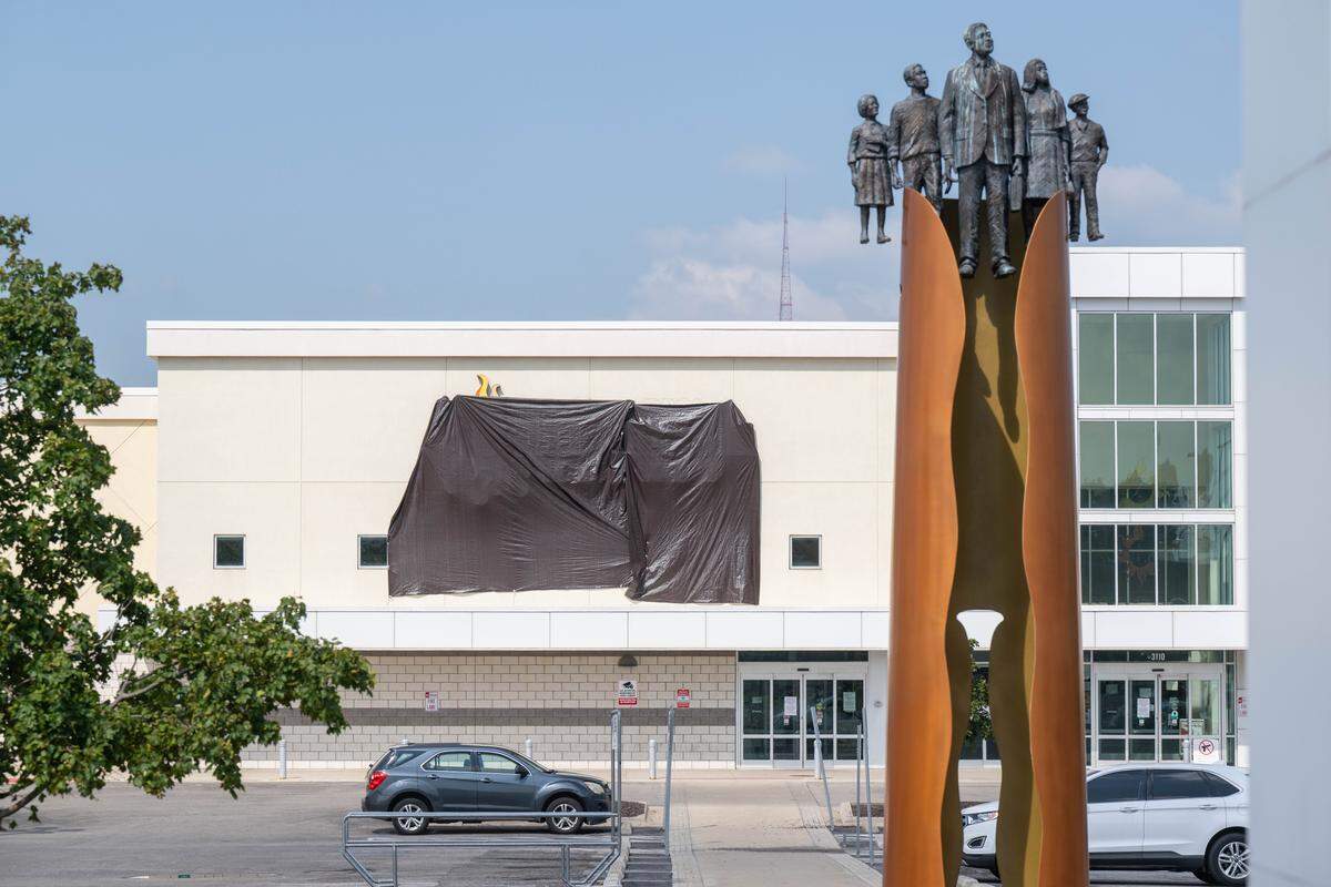 Sun Fresh Linwood with a black tarp covering its logo on Wednesday, Aug. 13, 2025, in Kansas City. The troubled grocery store closed the previous day.