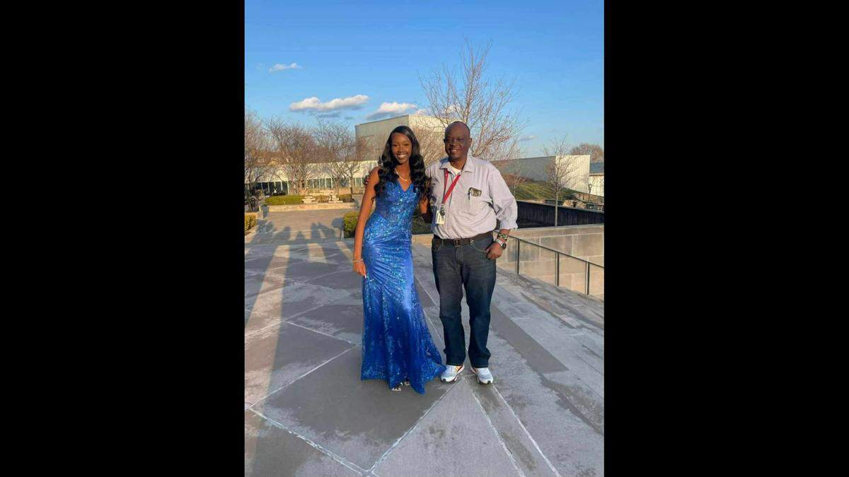 Jacob Birech poses for a photo with his daughter, Natalie, at her senior prom in spring 2023.