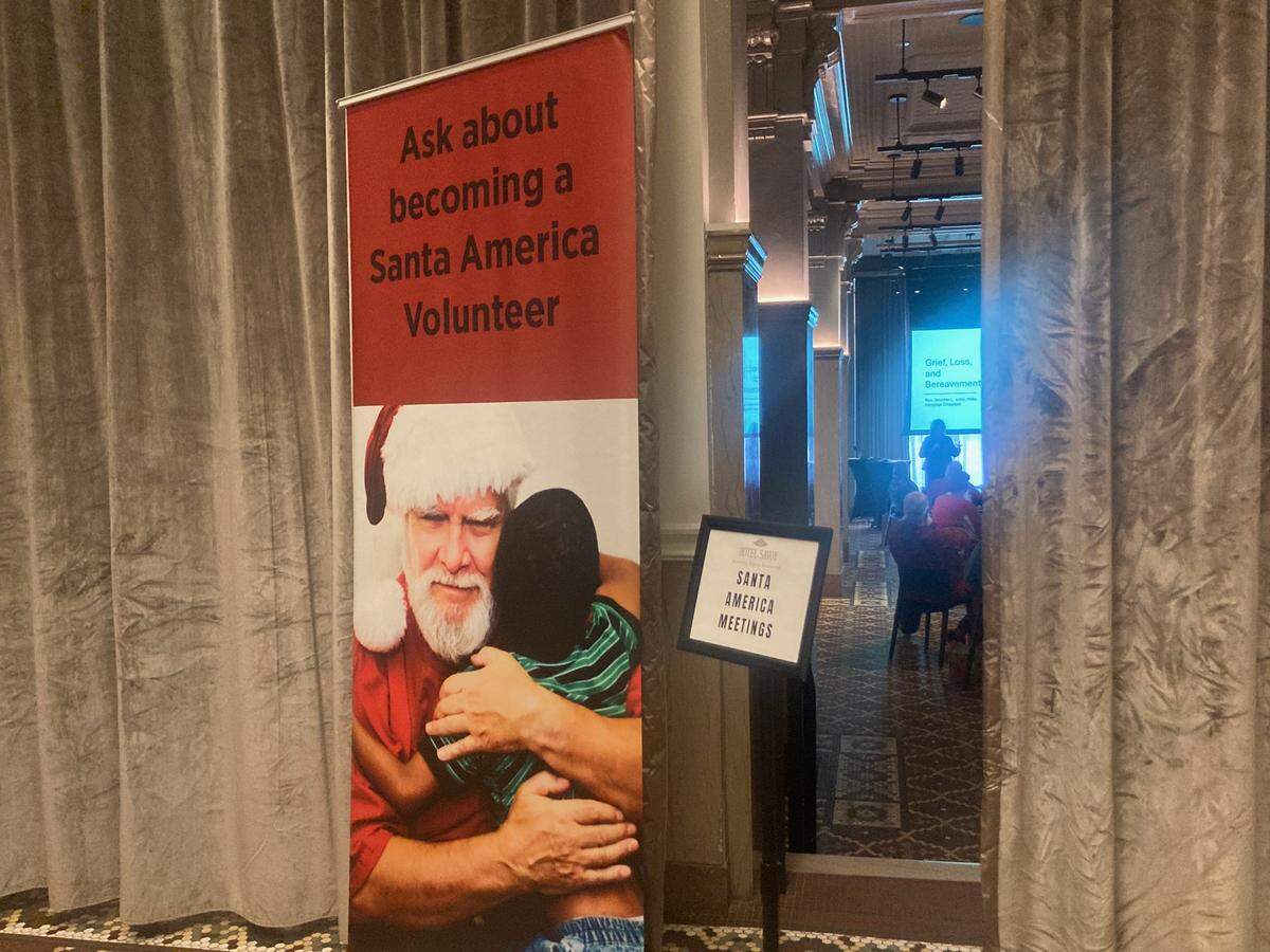 A sign at Santa America symposium being held at The Hotel Savoy in Kansas City. The organization, with some 120 volunteer Santas, focuses on sick and dying children or children with special sensitivities.