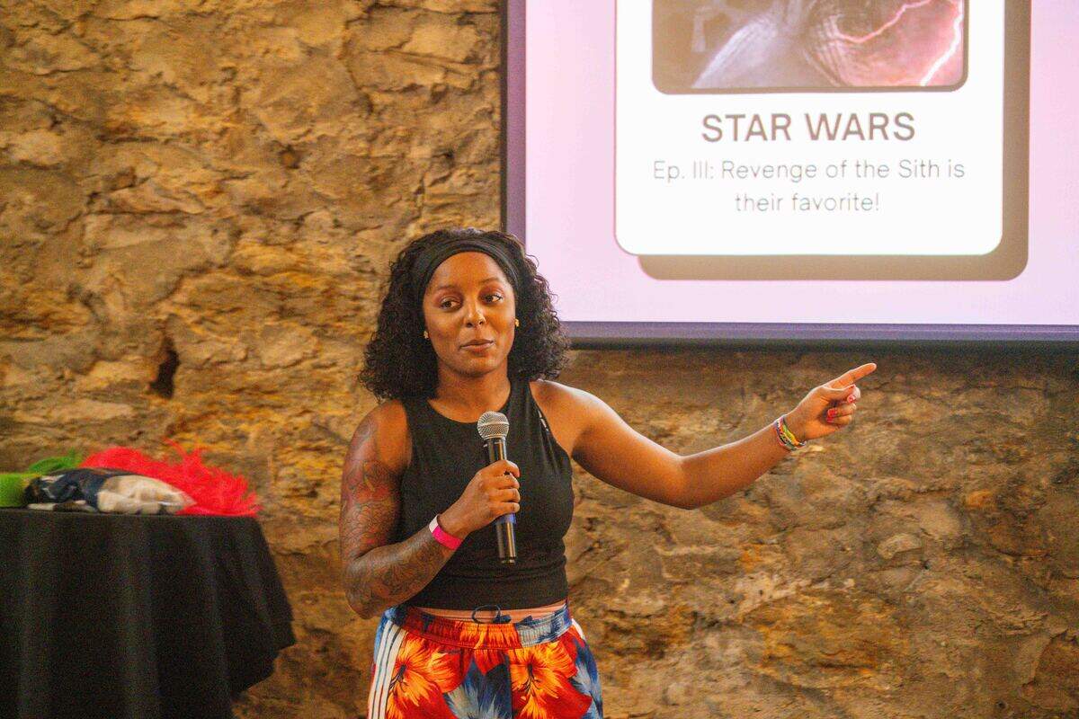 Taylor Watts pitches her friend, Adrien Townsend, to a room full of potential suitors at “Where To Find Us”, an event that invites friends to ‘pitch’ their friends to potential romantic and platonic partners in front of an audience.