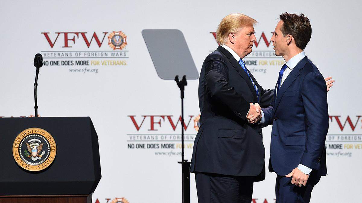 President Donald Trump greeted Missouri Attorney General Josh Hawley before speaking at the Veterans of Foreign Wars national convention Tuesday.