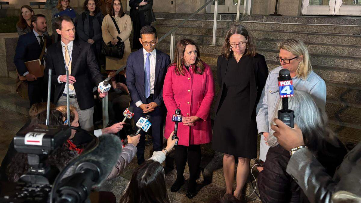 Individuals affiliated with Planned Parenthood speak to reporters after a court hearing at the Jackson County Courthouse on Wednesday.
