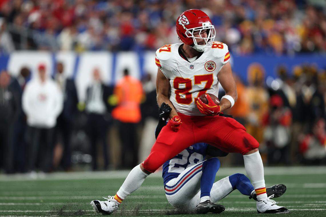 Kansas City Chiefs tight end Travis Kelce fights for yardage after the catch as New York Giants cornerback Cordale Flott defends during an NFL Week 3 game at MetLife Stadium in East Rutherford, New Jersey, on Sunday, Sept. 21, 2025.
