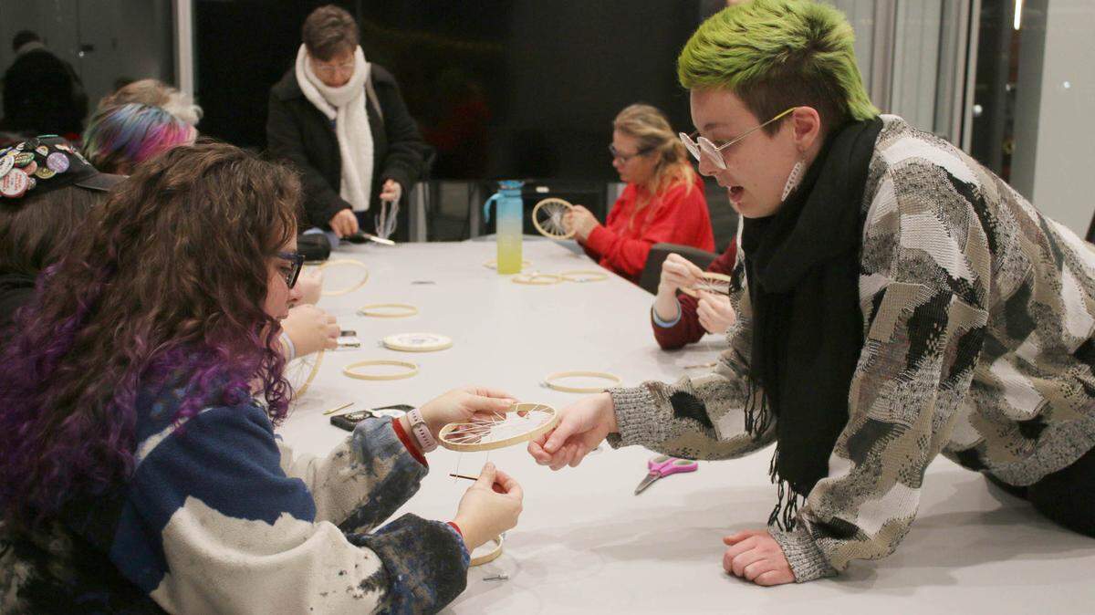 Overland Park resident Amira Mogharbel gets some advice from Makerspace specialist Kass Ulmer during a fiber arts class at the Downtown Olathe Library.