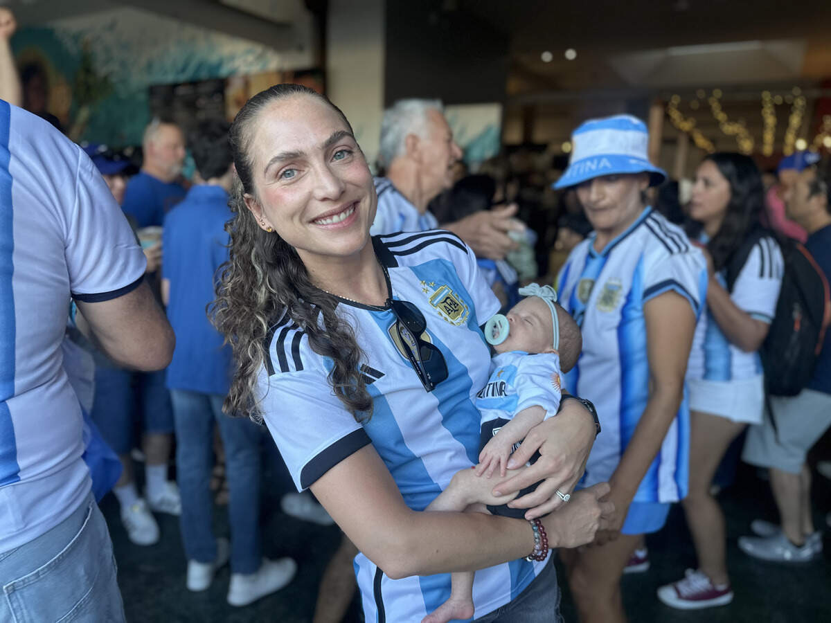 Mariana Albao poses with her sleeping 8-week-old, Olivia. Albao recently moved to Kansas City, though she is originally from Salta, Argentina.