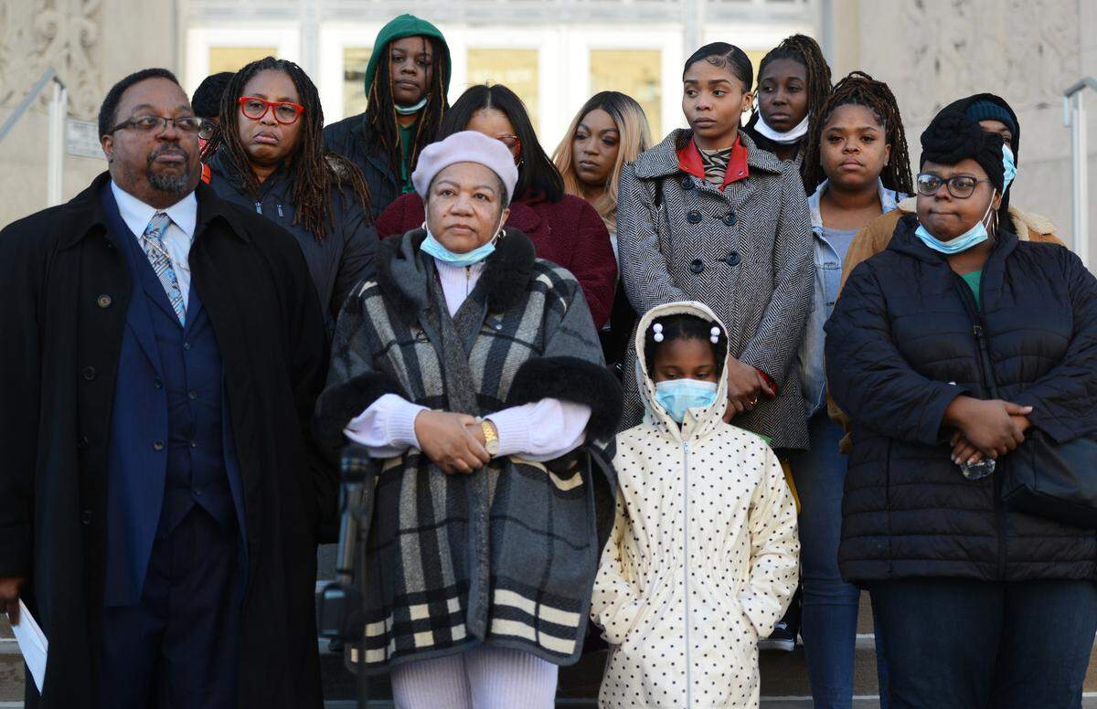 Family of Cameron Douglas, who was fatally shot by Jason K. Cook in 2019 in Kansas City, gather outside the Jackson County Courthouse following Cook’s sentencing on Wed. Dec. 22, 2021.