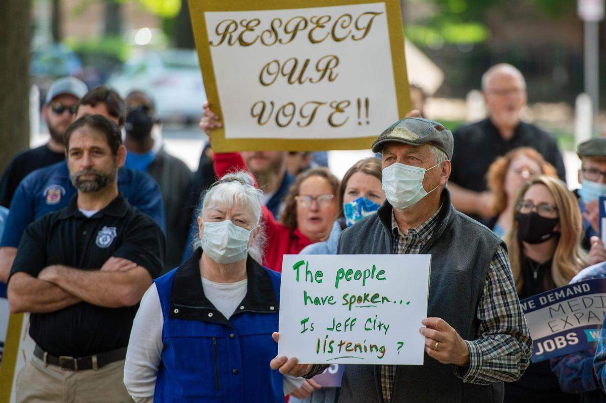 At a rally in Kansas City in 2021, a group called for Medicaid expansion and expressed anger at Gov. Mike Parson’s announcement that he would not implement the voter-approved expand the health care program.